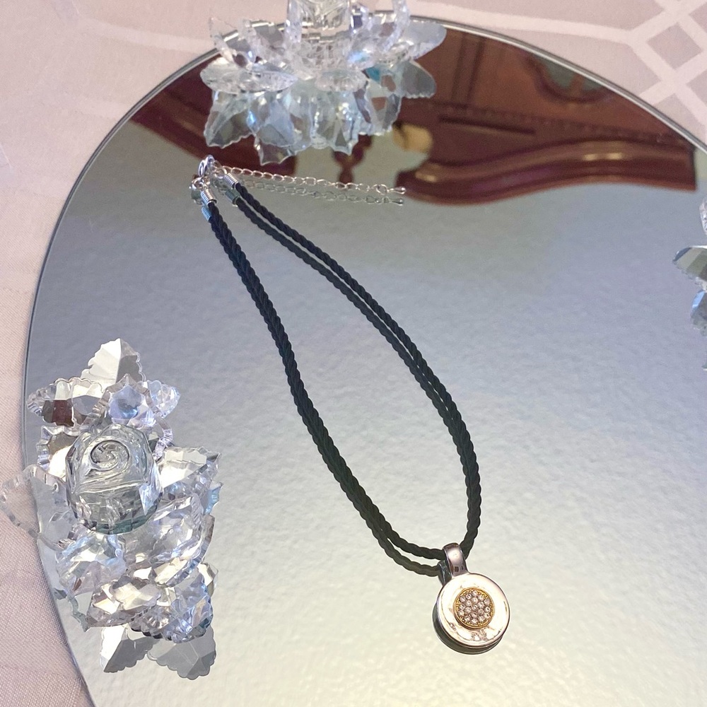 black necklace w/ silver & gold pendant